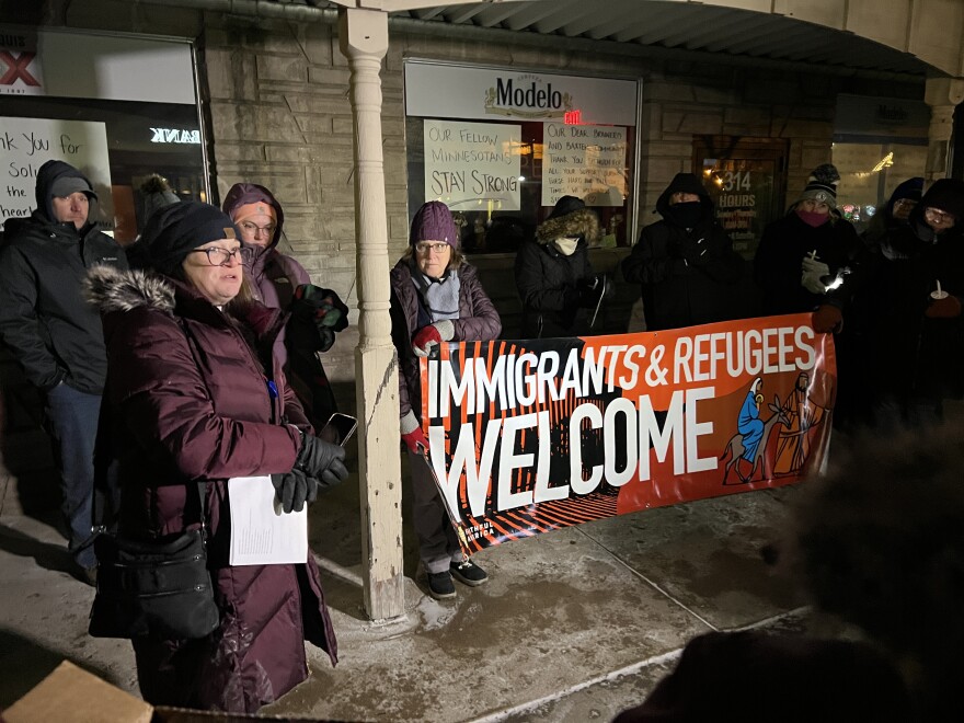 The Rev. Leslie Moughty, left, speaks to the group of community members gathered Jan. 27, 2026, at a vigil outside El Potro Mexican Restaurant in downtown Brainerd, following four arrests of employees by ICE.