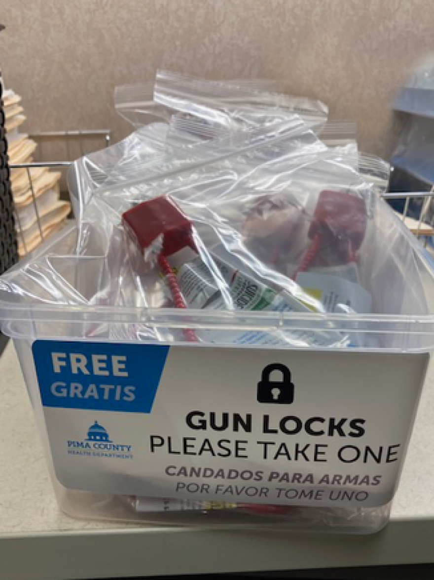 Gun locks in a bin