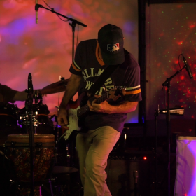 Rishi Maze performing live in WNIJ's Studio A