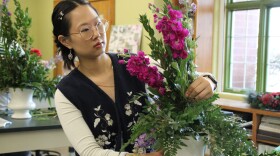 Sophie Ahrens, one of the Unexpected Bloom's scholarship recipients, works on an arrangement in her floral design program at Johnson County Community College.