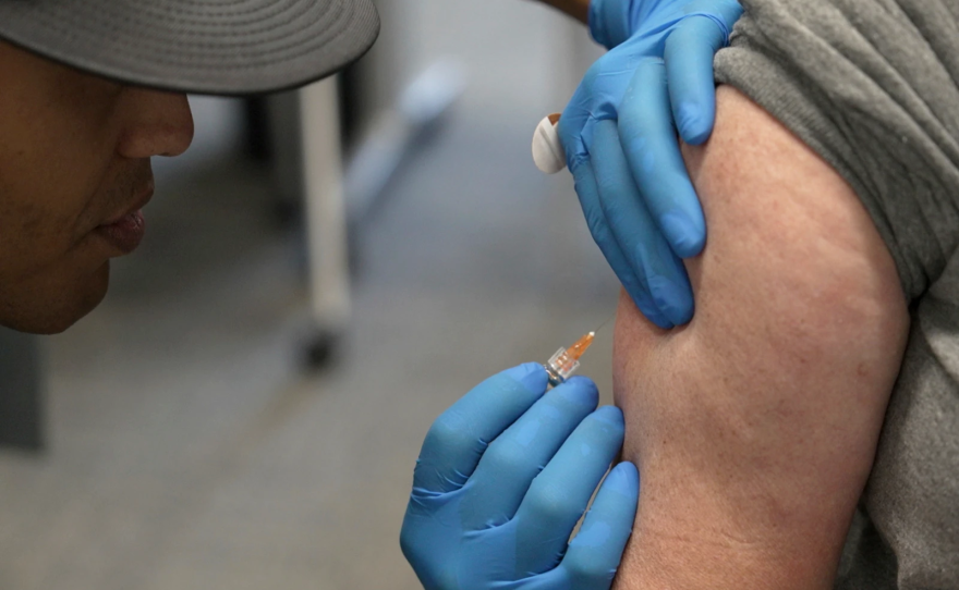An individual administers a measles, mumps and rubella vaccine on, Feb. 26, 2025, in Lubbock, Texas.