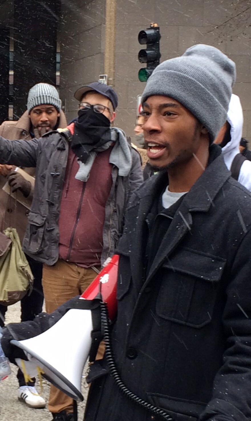 Rasheen Aldridge helps organize protesters on Market Street in downtown St. Louis on Wednesday, November 26, 2014.