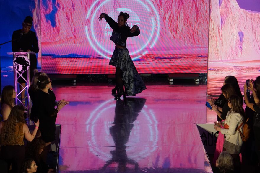 A model is silhouetted as she prepares to strut on the catwalk at the Far North Fashion Show, held April 15,, 2026, at the Anchorage Museum. The fashion show is part of the annual Arctic Encounter Summit.