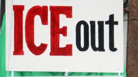 Sign held during a rally to support an individual detained by ICE in South Burlington 