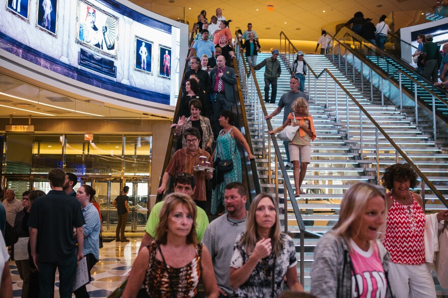 Patrons come down the escalator for the opening day of the Hard Rock Hotel and Casino in Atlantic City, N.J. on Thursday.