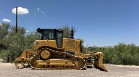 A bulldozer bearing the logo of Southwest Valley Constructors was seen near the entrance to Cottonwood Campground along the U.S-Mexico border in Big Bend National Park on Tuesday.