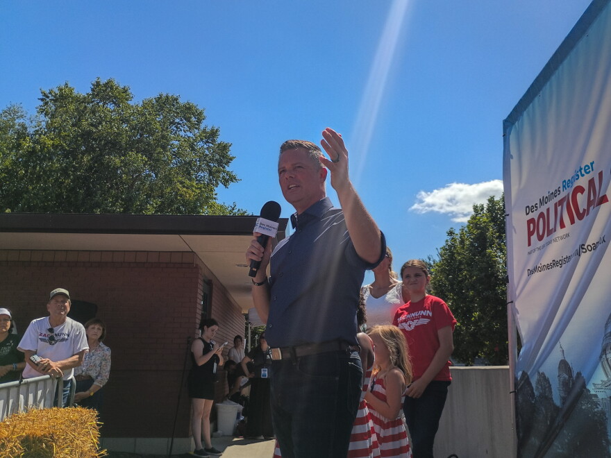 U.S. Rep. Zach Nunn delivers his Des Moines Register Political Soapbox speech at the Iowa State Fair on Monday. His family jointed him on stage.