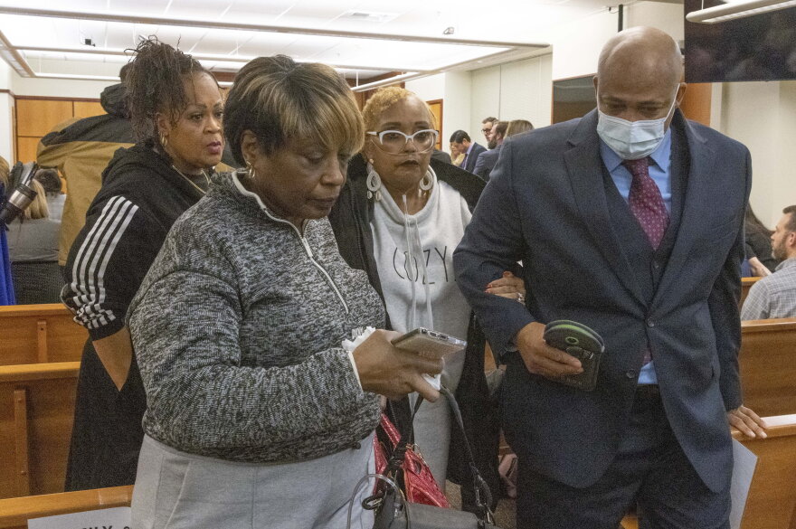 Manny Ellis' mother, Marcia Carter-Patterson, second from right, is escorted out of court by family attorney James Bible right, and other family members after Pierce County Judge Bryan Chushcoff reads the verdict from the jury for the killing of Manny Ellis in Pierce County Superior Court Thursday, December 21, 2023. All three of the officers, Timothy Rankine, Christopher “Shane” Burbank and Matthew Collins were declared not guilty for for any charges related to the March 2020 killing of Manny Ellis.