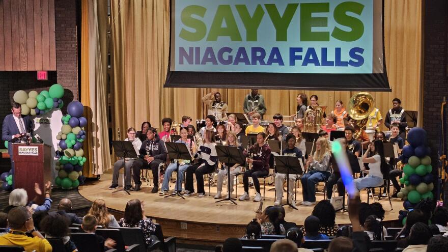 Students cheer for the introduction of the Niagara Falls Pep Band Tuesday at Harry F. Abate Elementary School in Niagara Falls.