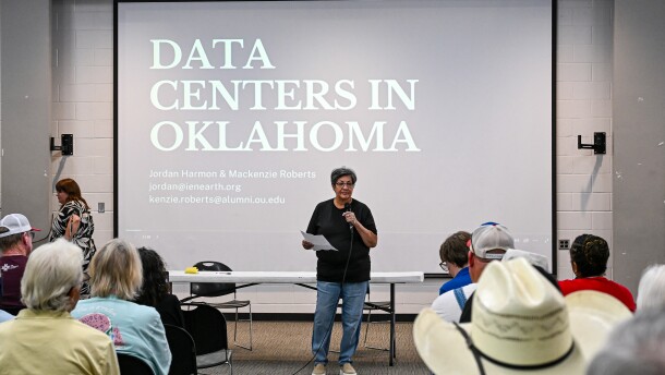 Honor the Earth Volunteer Coordinator Patricia Kaseca stands at the front of the room to introduce herself to her Muskogee neighbors. She helped organize Muskogee's first town hall to inform those in her town about the data centers in Oklahoma.