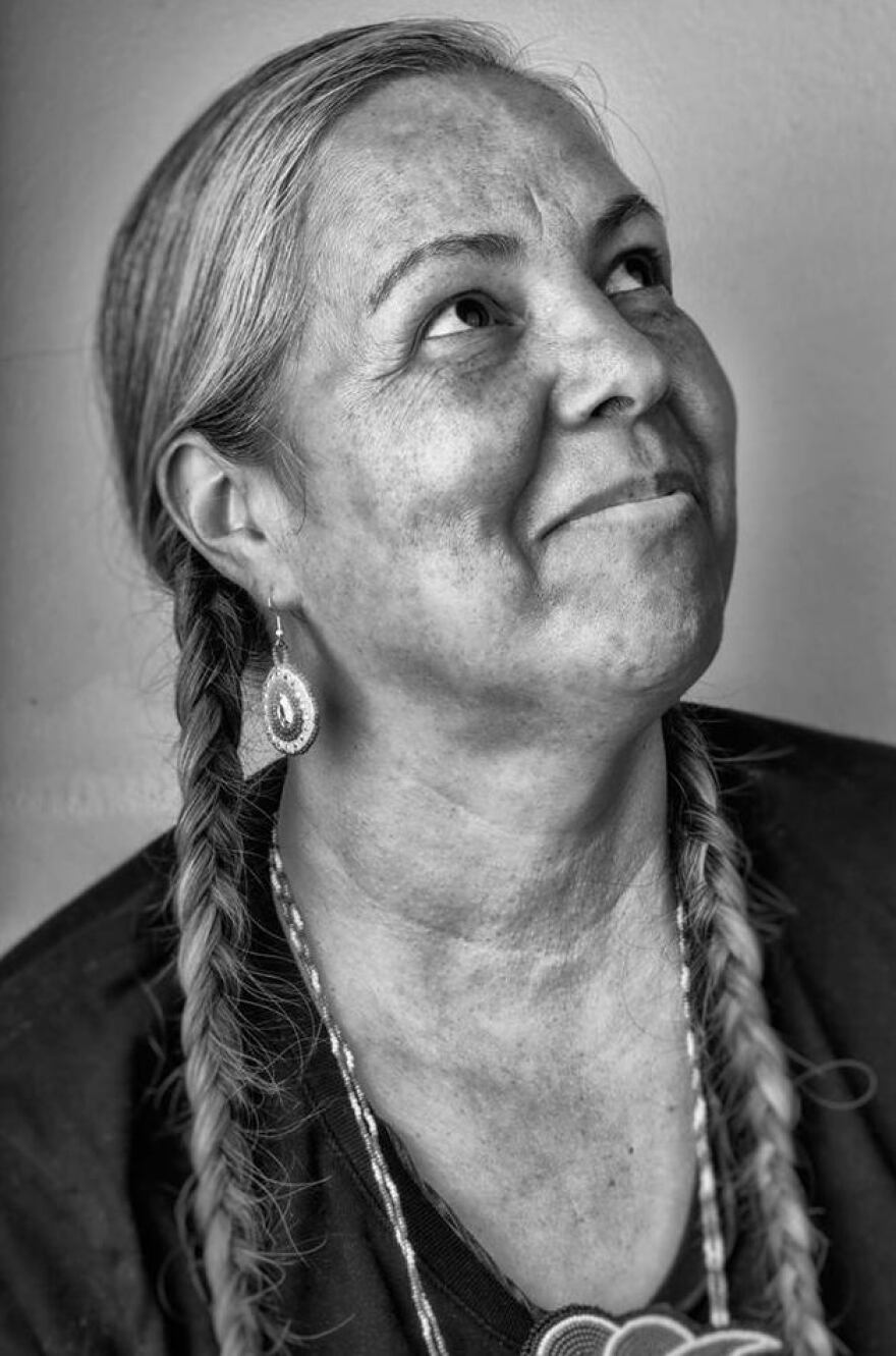 Red Corn's portraits of smiling Native American people are not "radical," he says.