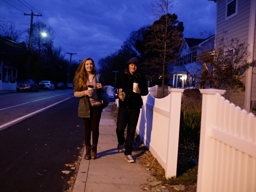 Lily and Isaac walk to catch the bus at 6:35 in the morning.