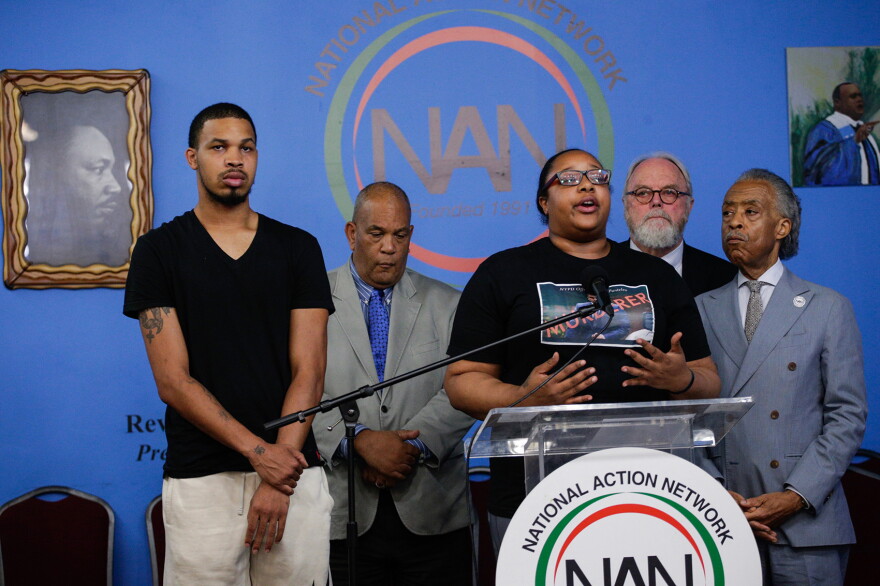 Eric Garner's daughter Emerald Garner and Rev. Al Sharpton (right) speak to the media on August 19, 2019 in New York City. The New York Police Department announced that Officer Daniel Pantaleo has been fired from the force due to his involvement in Eric Garner's death in 2014. (Kena Betancur/Getty Images)