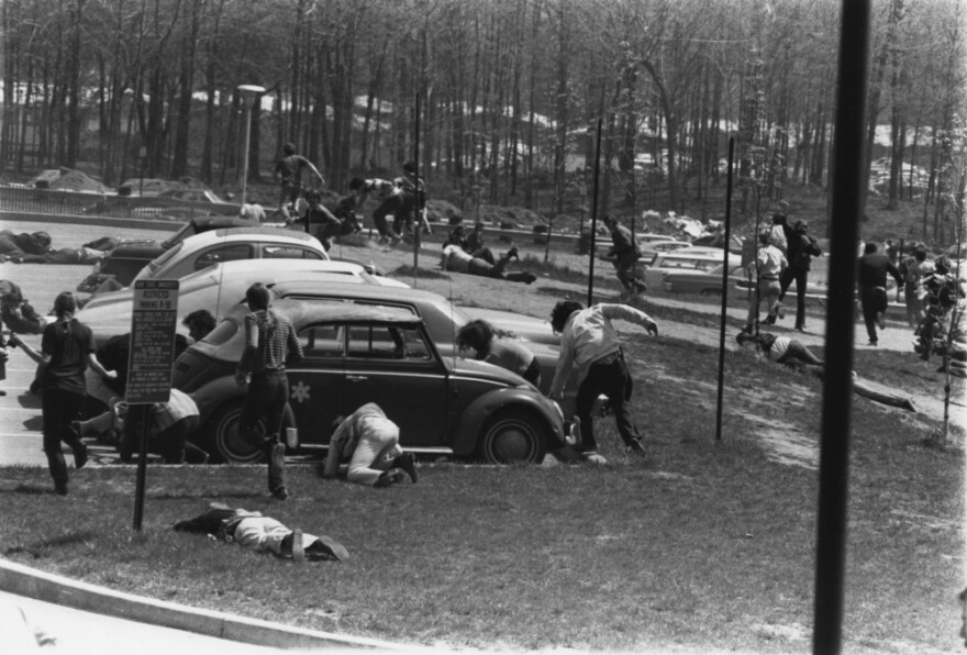 Students running in the parking lot at Kent State University