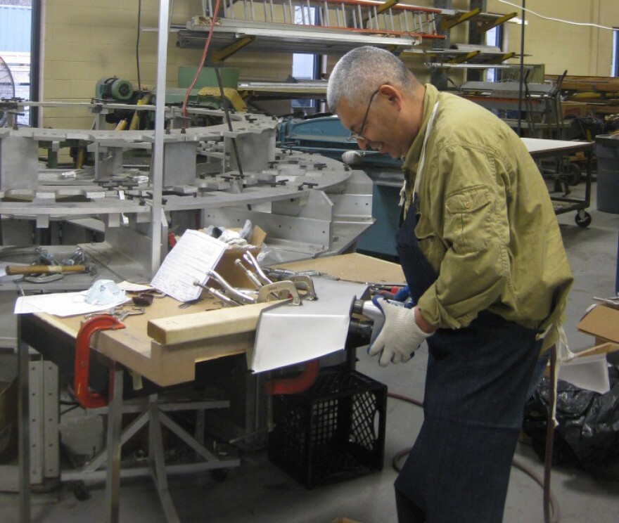 An employee at GSE Dynamics, a small manufacturing company that makes parts for the Navy and Air Force.