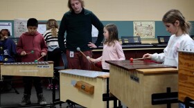 Kids in Maggie Olivo's music class work to compose their own melodies on the xylophone.