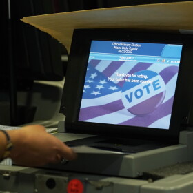 A Miami-Dade County Elections Department employee tests voting equipment that will be used in the upcoming state primary election, Wednesday, Aug. 3, 2022, in Doral, Fla. Early voting starts Monday, Aug. 8. (AP Photo/Marta Lavandier)