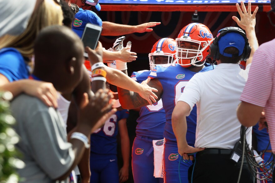 Gator football team members greet fans before the first home game at Ben Hill Griffin Stadium against the Tennessee Volunteers on Sept. 16, 2017. The Gators won 26-20 by making a tie-breaking touchdown with zero seconds on the clock. (Emma Green/ WUFT News)