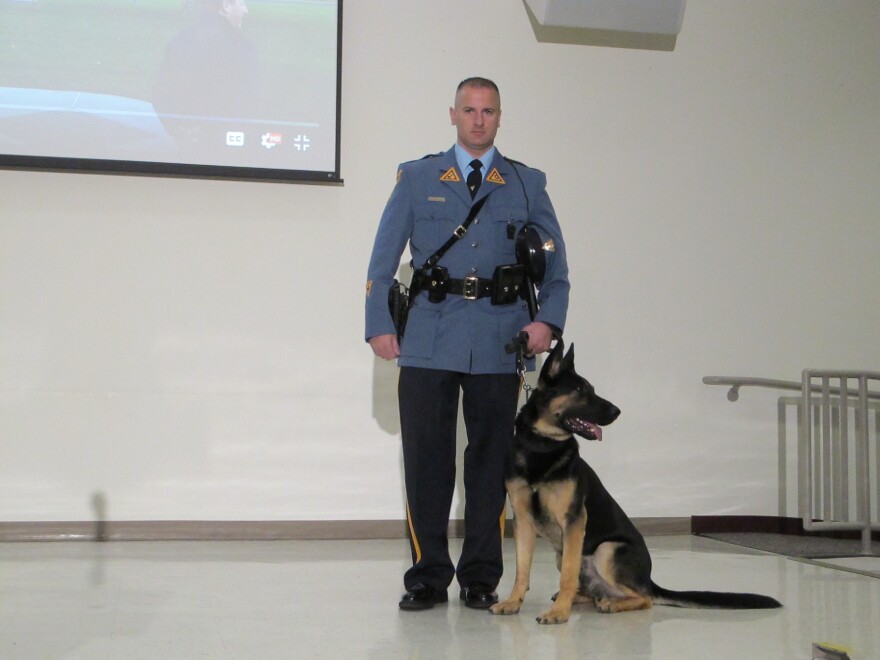 State Police electronics-sniffing dog Mega with his handler