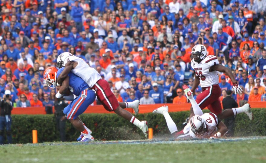 A South Carolina defender brings down Treon Harris for a loss of yards.