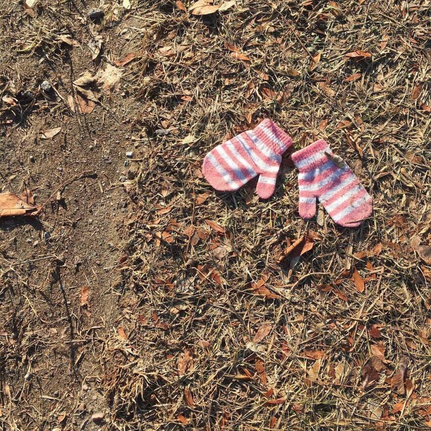 pink mittens on the ground