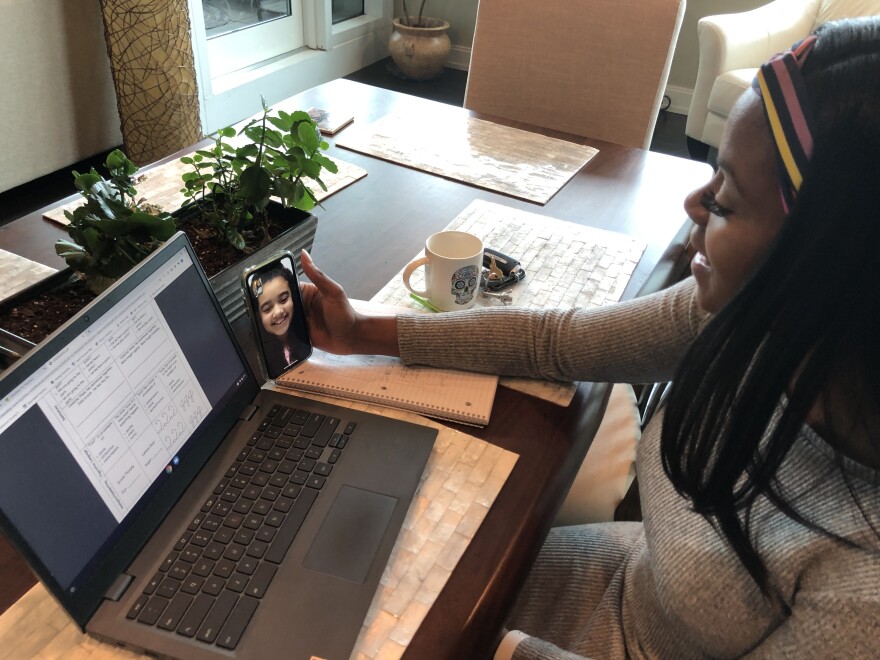 Lincoln Elementary Performing Arts teacher KeNiesha Watkins works with her 4th grade student Addison over FaceTime during the school closure.