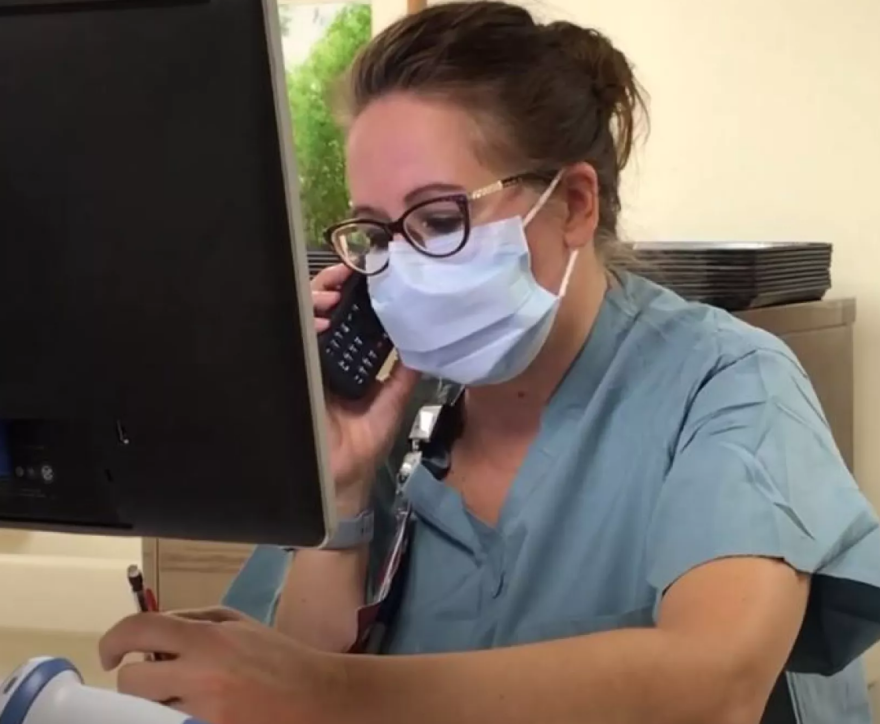 Nurse Tracy Hill works at her desk at Mercy Springfield during the pandemic