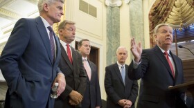 Sen. Lindsey Graham (right), R-S.C., stands with Sen. Bill Cassidy (left), R-La., Sen. Dean Heller (second from left), R-Nev., and Sen. Ron Johnson (second from right), R-Wisc., as well as former Sen. Rick Santorum (center) to announce their legislation to repeal and replace the Affordable Care Act through block grants on Capitol Hill in Washington, D.C., on Sept. 13, 2017. (Jim Watson/AFP/Getty Images)
