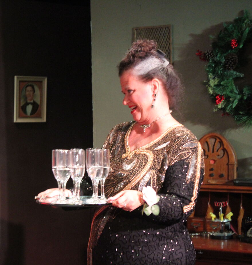 Cindi Heimberg serves up the bubbly at her son's Christmas Eve dinner party.