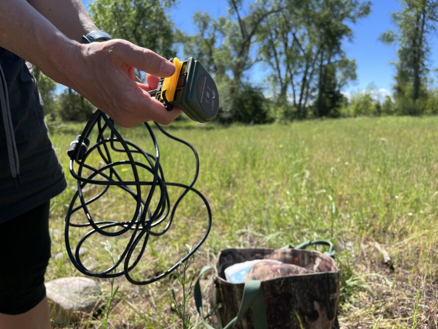 Research statistician Kathi Irvine with the U.S. Geological Survey holds a device used to capture bat search calls.