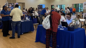 Residents walk around and talk with various community health organizations at the Health Fair and Falls Expo at the Alachua County Senior Recreation Center.