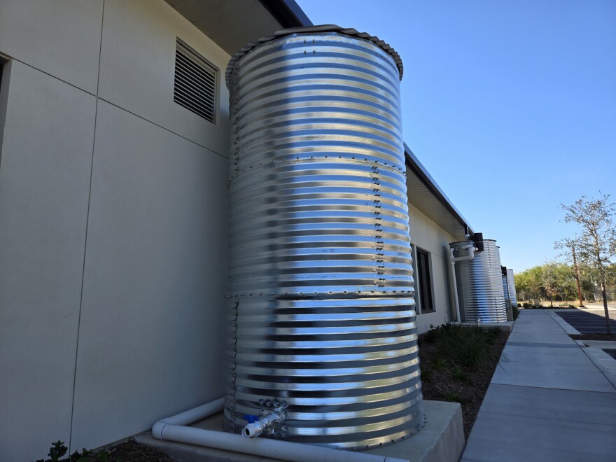 The farm has sustainable features, such as this row of cisterns, that can collect rainwater for irrigation.