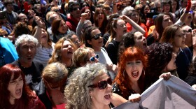 Protesters chant "It's not abuse, it's rape!" after a nine-year prison sentence was given to five men accused of the multiple rape of a woman during Pamplona's San Fermin festival in 2016.