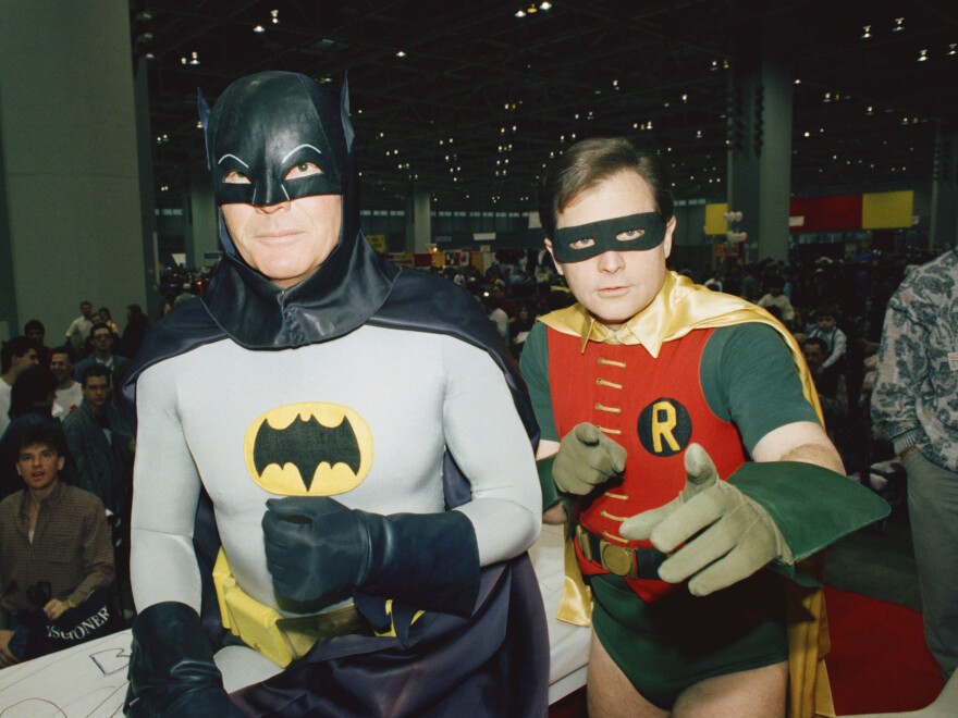 Actors Adam West (L)and Burt Ward dressed as their characters (Zappp!) "Batman" and (Powww!) "Robin," on Jan. 27, 1989 at the "World of Wheels" custom car show in Chicago.