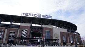 Fans arrives at Truist Park, home of the Atlanta Braves, to attend the memorial for Baseball Hall of Famer and Braves legend Hank Aaron, Tuesday, Jan. 26, 2021, in Atlanta. 