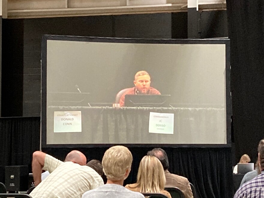 Commissioner J.C. Deriso on screen during the public meeting