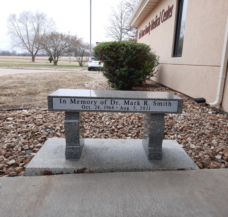Memorial bench for Mark Smith outside of the Ash Grove Family Medical Center, the last place he worked. Photo taken by Meghan McKinney/ KSMU