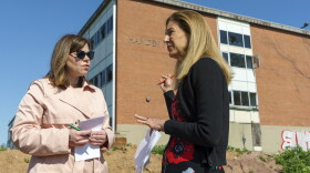 Hamden Mayor Lauren Garrett (left) and Lieutenant Governor Susan Bysiewicz talk outside Hamden Middle School during an announcement that site , which has stood vacant for years, will soon be demolished to make way for a new “community campus."