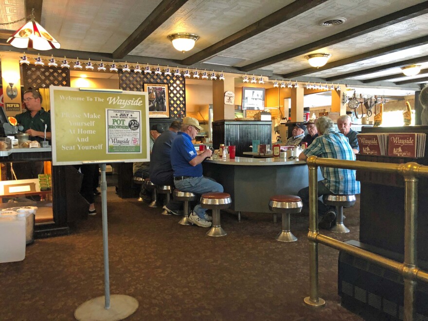 The sign by the door of the Wayside Restaurant invites customers to "Please make yourself at home and seat yourself."