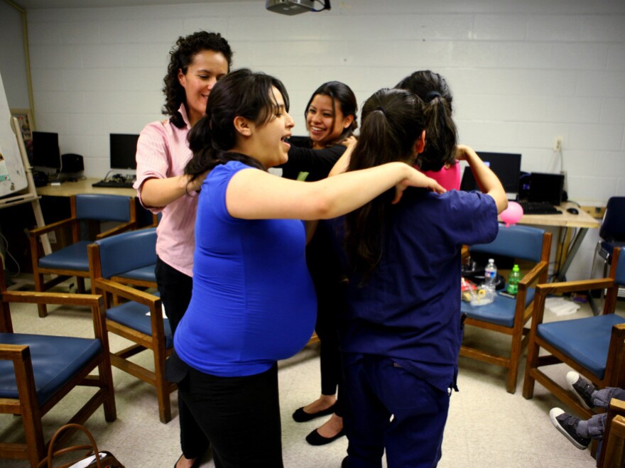 Members of the group give each other a back massage during the class. The woman who created the centering model, Sharon Schindler Rising, says "there's tremendous power in the group."