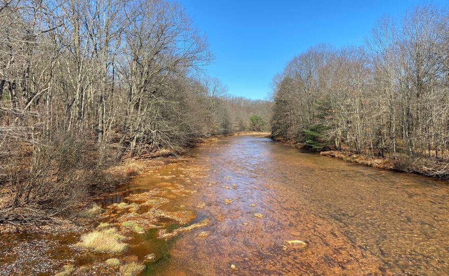 A stream along Coaldale Road in Rush Township, Centre County, runs orange from acid mine drainage.