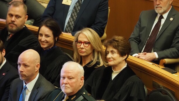 Arkansas Supreme Court Chief Justice Karen Baker (right) sits with Associate Justices (from left) Shawn Womack, Rhonda Wood and Courtney Hudson as they wait for an address from the governor in the Arkansas House of Representatives on Jan. 14, 2025.