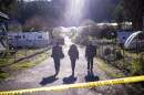 FBI officials walk towards the crime scene at Mountain Mushroom Farm, on Jan. 24, 2023, after a gunman killed several people at two agricultural businesses in Half Moon Bay, Calif.
