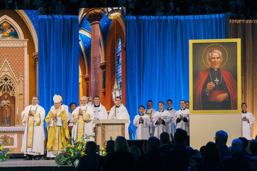 Cardinal Luis Antonio Tagle, Pope Leo XIV's special envoy, stands with clergy as a portrait of the late Archbishop Fulton J. Sheen is unveiled after Sheen was declared "Blessed" during his beatification Mass on Thursday.