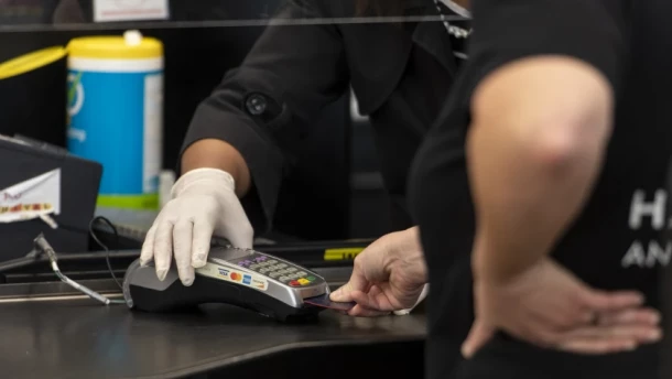 A new state law to end credit card fees on sales tax and tips that businesses pay has been delayed by Illinois lawmakers.