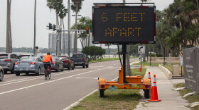 Sign on Bayshore Boulevard says 6 Feet Apart