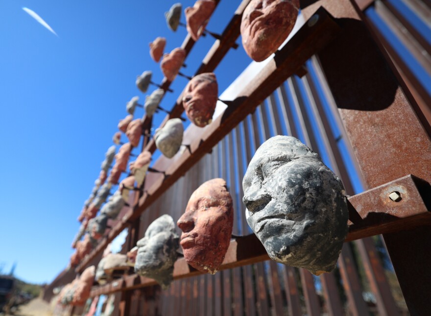 A local art display along the border fence in Nogales, Mexico, represents the faces of migrants who have made the dangerous journey to the U.S.-Mexico border. Photo taken on Feb. 24, 2025.