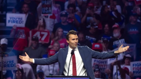 Turning Point USA Founder Charlie Kirk speaks during a campaign rally for Trump in Glendale, Ariz., in August 2024.