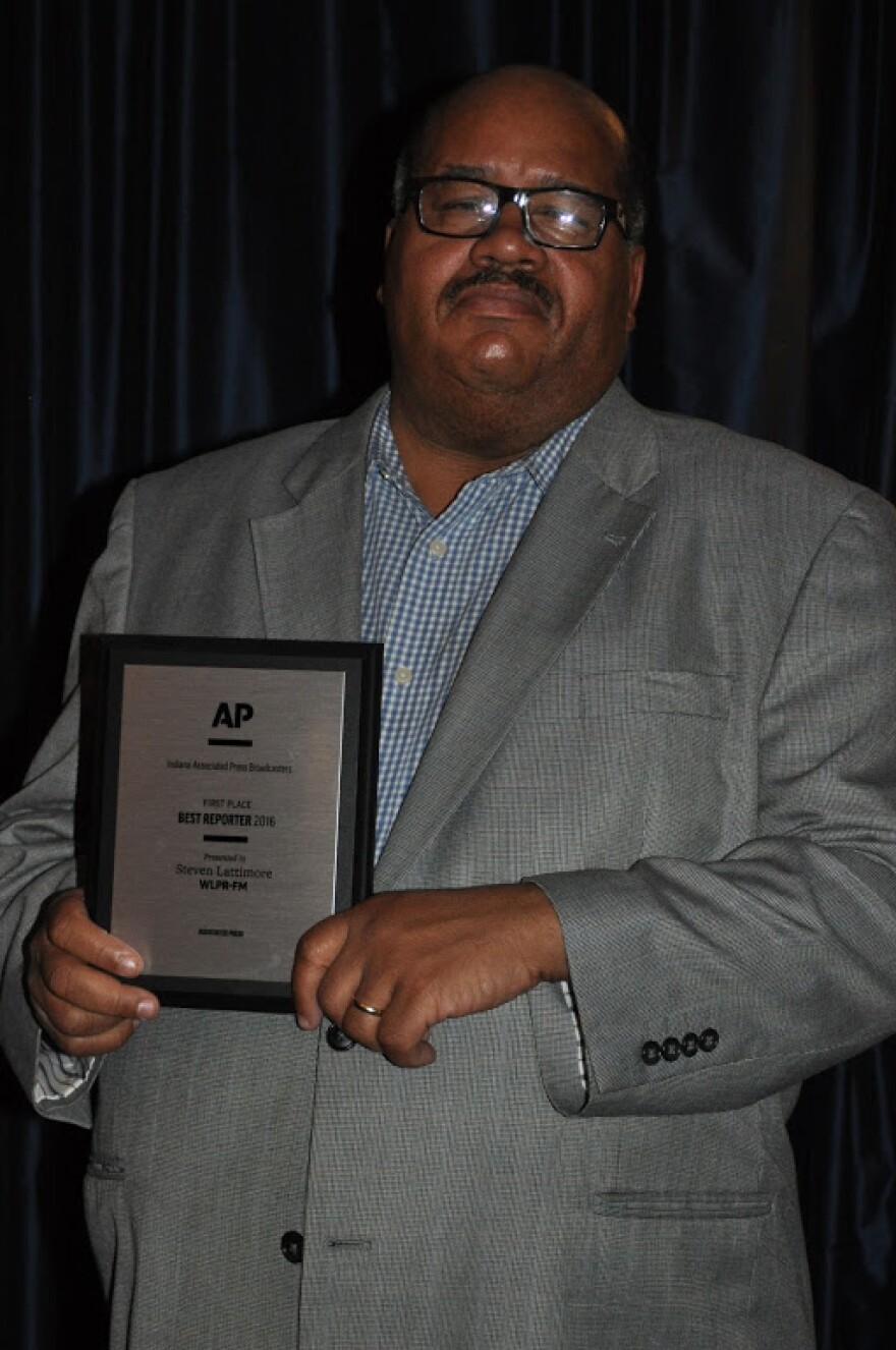 Steven Lattimore poses with his "Best Reporter" Award from the Indiana Associated Press Awards on Saturday, April 15, 2017.
