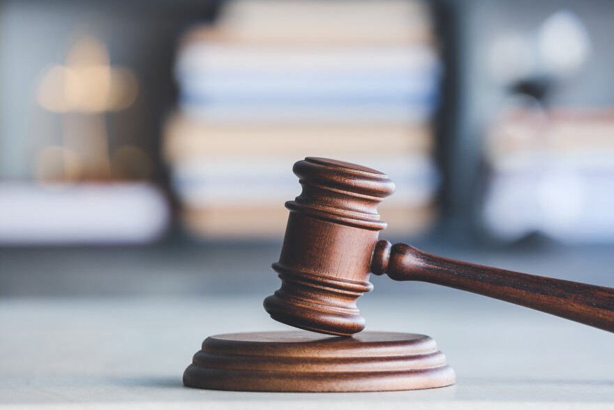 Judge's gavel on table in office.